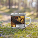 Right View Custom Hastings Minnesota Map Enamel Mug in Ember on Grass With Trees in Background