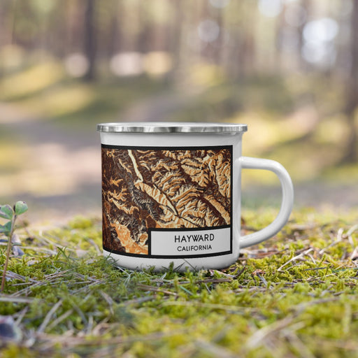 Right View Custom Hayward California Map Enamel Mug in Ember on Grass With Trees in Background