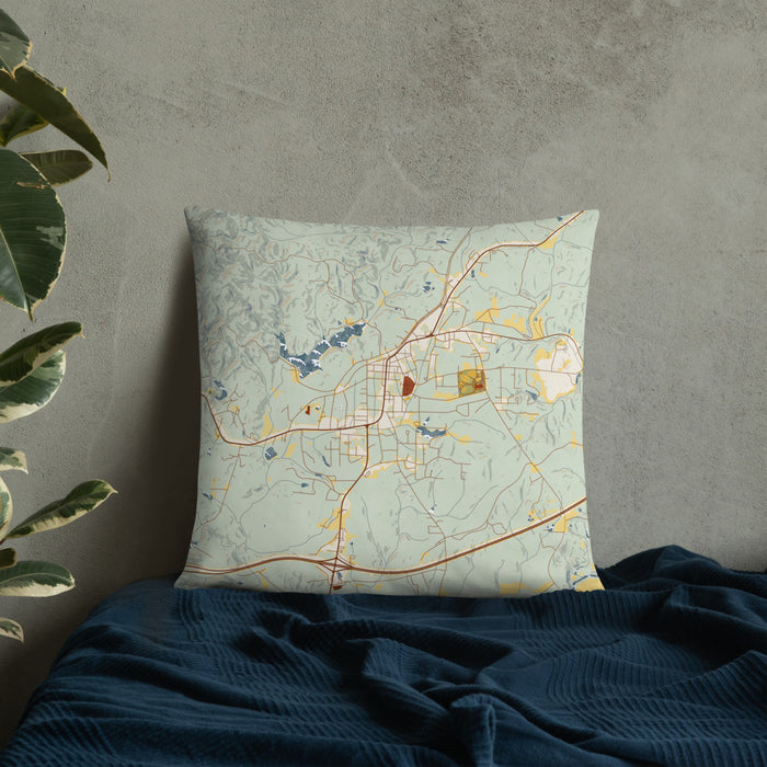 Custom Heflin Alabama Map Throw Pillow in Woodblock on Bedding Against Wall