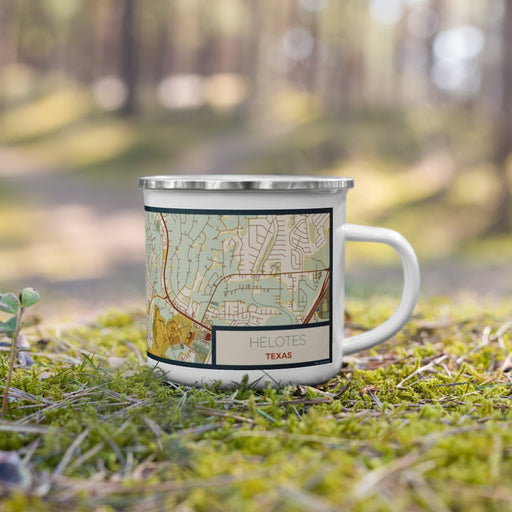 Right View Custom Helotes Texas Map Enamel Mug in Woodblock on Grass With Trees in Background