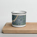 Front View Custom Henderson Kentucky Map Enamel Mug in Afternoon on Cutting Board