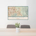 24x36 Henderson Nevada Map Print Landscape Orientation in Woodblock Style Behind 2 Chairs Table and Potted Plant