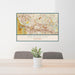 24x36 Herndon Virginia Map Print Lanscape Orientation in Woodblock Style Behind 2 Chairs Table and Potted Plant