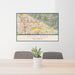 24x36 Highland California Map Print Lanscape Orientation in Woodblock Style Behind 2 Chairs Table and Potted Plant