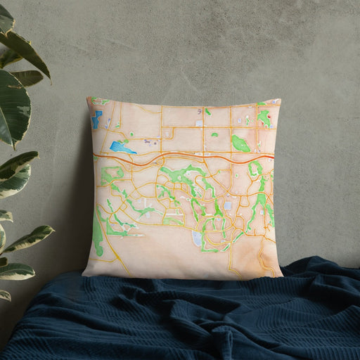 Custom Highlands Ranch Colorado Map Throw Pillow in Watercolor on Bedding Against Wall
