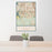 24x36 Highlands Ranch Colorado Map Print Portrait Orientation in Woodblock Style Behind 2 Chairs Table and Potted Plant