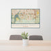 24x36 Highlands Ranch Colorado Map Print Landscape Orientation in Woodblock Style Behind 2 Chairs Table and Potted Plant