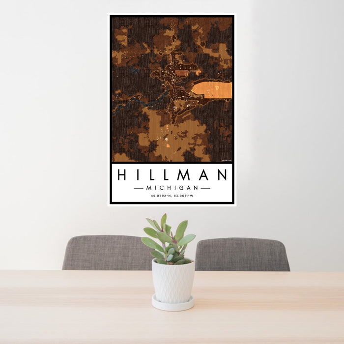 24x36 Hillman Michigan Map Print Portrait Orientation in Ember Style Behind 2 Chairs Table and Potted Plant