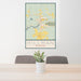 24x36 Hillman Michigan Map Print Portrait Orientation in Woodblock Style Behind 2 Chairs Table and Potted Plant
