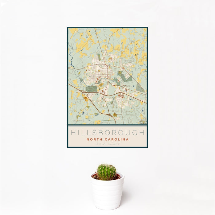 12x18 Hillsborough North Carolina Map Print Portrait Orientation in Woodblock Style With Small Cactus Plant in White Planter