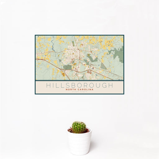 12x18 Hillsborough North Carolina Map Print Landscape Orientation in Woodblock Style With Small Cactus Plant in White Planter