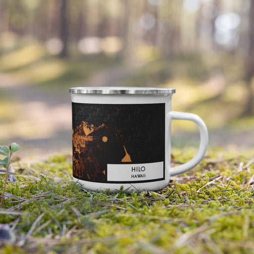 Right View Custom Hilo Hawaii Map Enamel Mug in Ember on Grass With Trees in Background