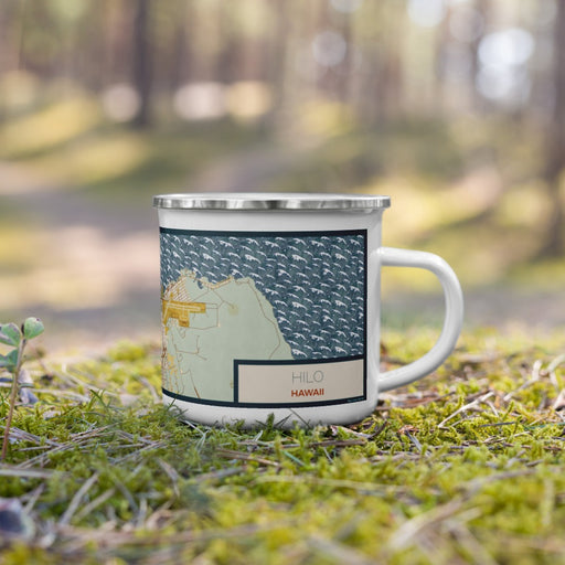 Right View Custom Hilo Hawaii Map Enamel Mug in Woodblock on Grass With Trees in Background