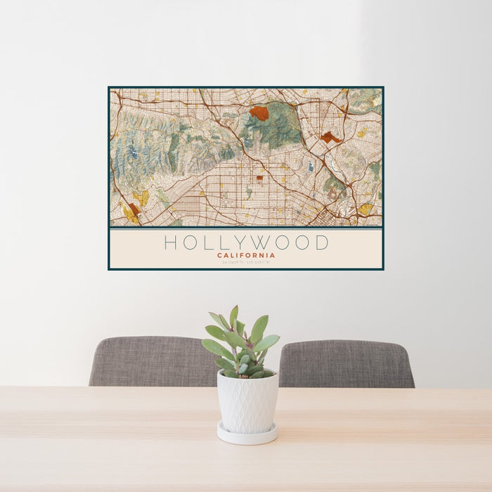 24x36 Hollywood California Map Print Landscape Orientation in Woodblock Style Behind 2 Chairs Table and Potted Plant