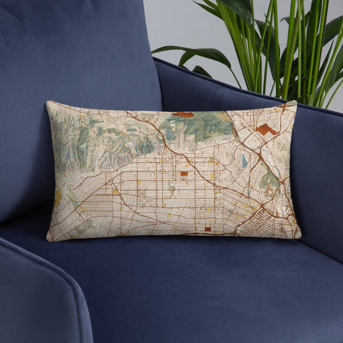Custom Hollywood California Map Throw Pillow in Woodblock on Blue Colored Chair