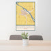 24x36 Homedale Idaho Map Print Portrait Orientation in Woodblock Style Behind 2 Chairs Table and Potted Plant
