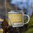 Right View Custom Homedale Idaho Map Enamel Mug in Woodblock on Grass With Trees in Background