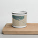 Front View Custom Homer Alaska Map Enamel Mug in Afternoon on Cutting Board