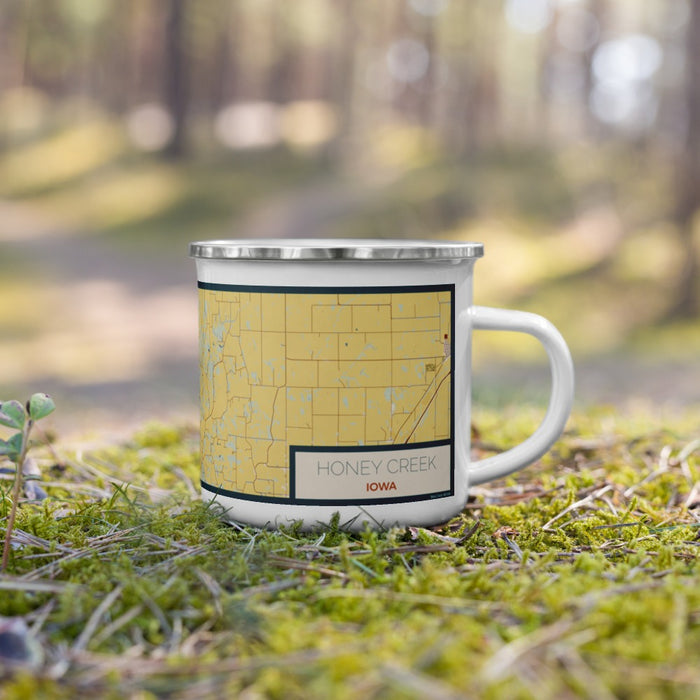 Right View Custom Honey Creek Iowa Map Enamel Mug in Woodblock on Grass With Trees in Background
