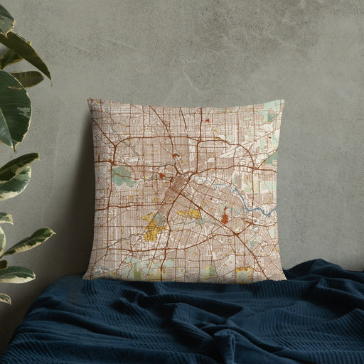 Custom Houston Texas Map Throw Pillow in Woodblock on Bedding Against Wall