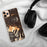 Custom Hunter New York Map Phone Case in Ember on Table with Black Headphones