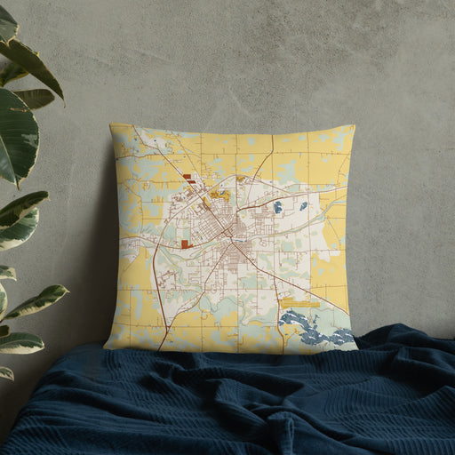 Custom Huntington Indiana Map Throw Pillow in Woodblock on Bedding Against Wall