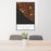 24x36 Huntington Beach California Map Print Portrait Orientation in Ember Style Behind 2 Chairs Table and Potted Plant