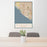 24x36 Huntington Beach California Map Print Portrait Orientation in Woodblock Style Behind 2 Chairs Table and Potted Plant