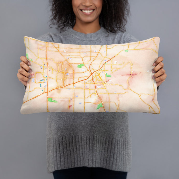 Person holding 20x12 Custom Huntsville Alabama Map Throw Pillow in Watercolor