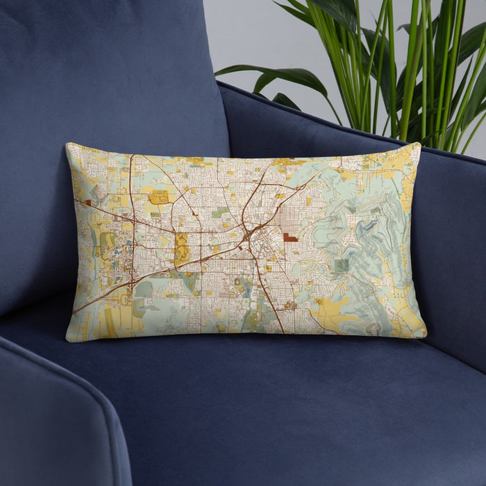 Custom Huntsville Alabama Map Throw Pillow in Woodblock on Blue Colored Chair