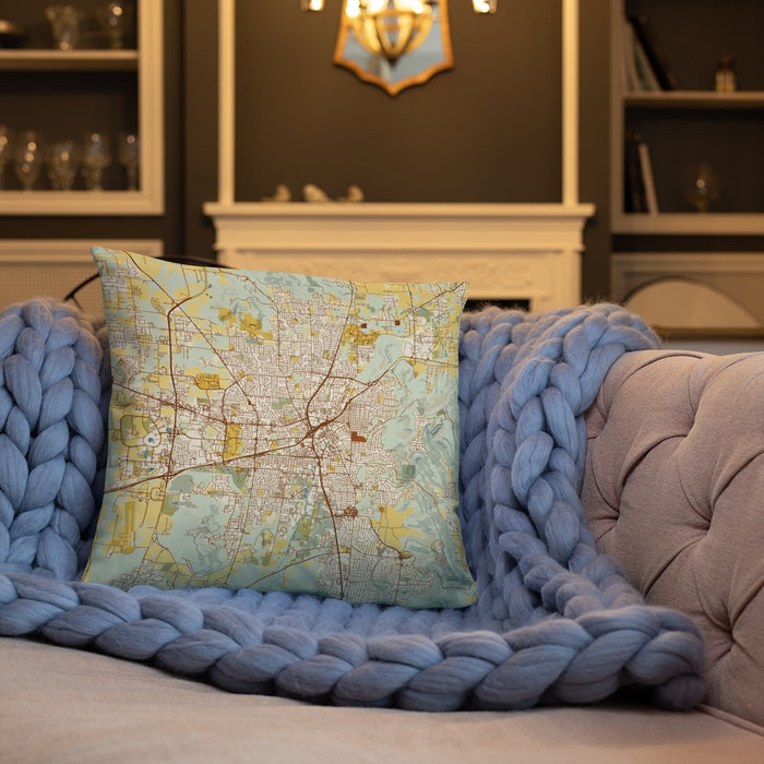 Custom Huntsville Alabama Map Throw Pillow in Woodblock on Cream Colored Couch