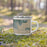 Right View Custom Hurlburt Field Florida Map Enamel Mug in Afternoon on Grass With Trees in Background