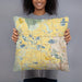 Person holding 18x18 Custom Hygiene Colorado Map Throw Pillow in Woodblock