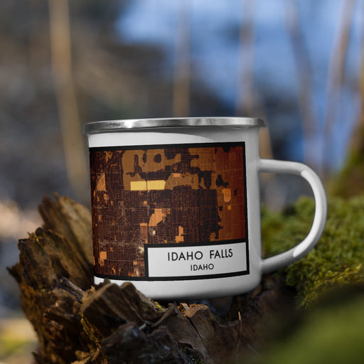 Right View Custom Idaho Falls Idaho Map Enamel Mug in Ember on Grass With Trees in Background