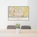 24x36 Independence Missouri Map Print Lanscape Orientation in Woodblock Style Behind 2 Chairs Table and Potted Plant