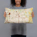 Person holding 20x12 Custom Independence Missouri Map Throw Pillow in Woodblock