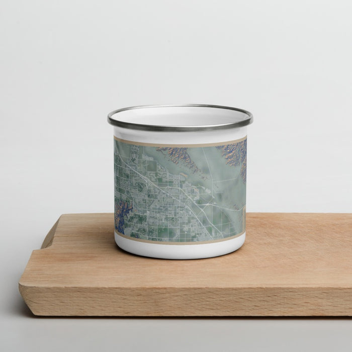 Front View Custom Indio California Map Enamel Mug in Afternoon on Cutting Board