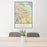 24x36 Indio California Map Print Portrait Orientation in Woodblock Style Behind 2 Chairs Table and Potted Plant