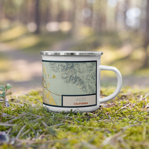 Right View Custom Indio California Map Enamel Mug in Woodblock on Grass With Trees in Background