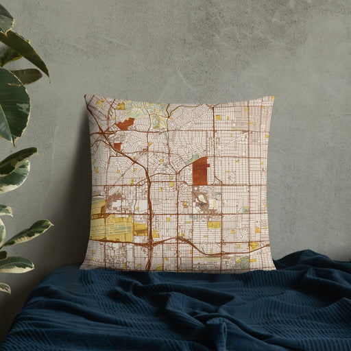 Custom Inglewood California Map Throw Pillow in Woodblock on Bedding Against Wall