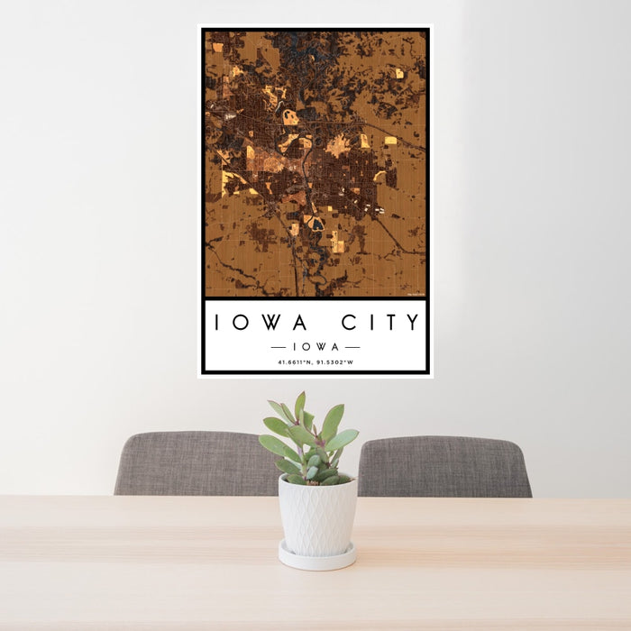 24x36 Iowa City Iowa Map Print Portrait Orientation in Ember Style Behind 2 Chairs Table and Potted Plant