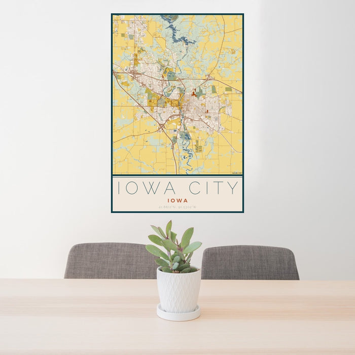 24x36 Iowa City Iowa Map Print Portrait Orientation in Woodblock Style Behind 2 Chairs Table and Potted Plant