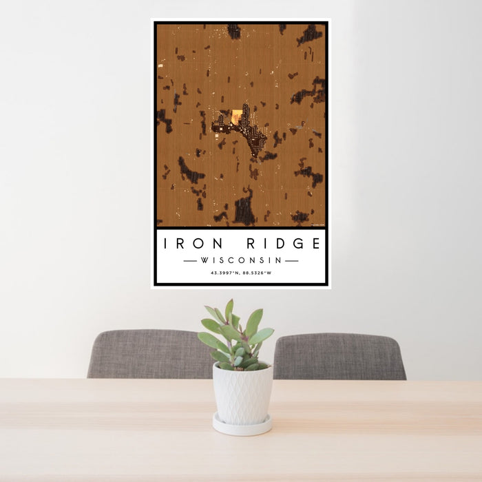 24x36 Iron Ridge Wisconsin Map Print Portrait Orientation in Ember Style Behind 2 Chairs Table and Potted Plant