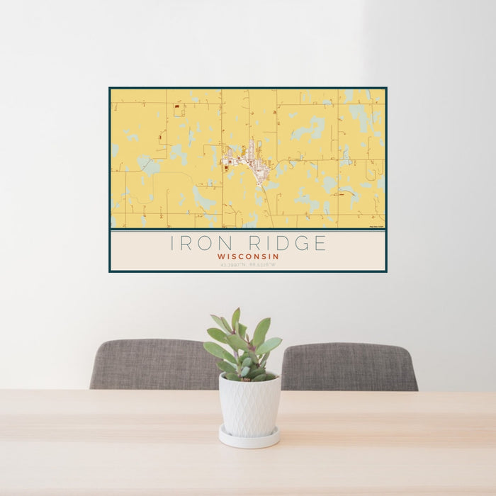 24x36 Iron Ridge Wisconsin Map Print Lanscape Orientation in Woodblock Style Behind 2 Chairs Table and Potted Plant