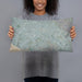 Person holding 20x12 Custom Irvine California Map Throw Pillow in Afternoon