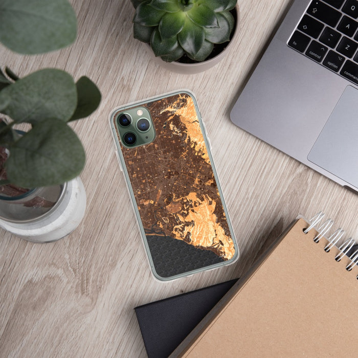 Custom Irvine California Map Phone Case in Ember on Table with Laptop and Plant