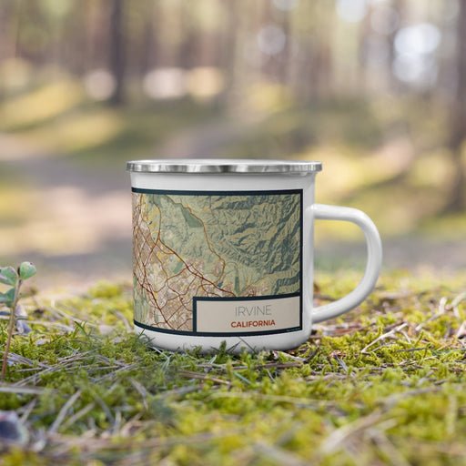 Right View Custom Irvine California Map Enamel Mug in Woodblock on Grass With Trees in Background