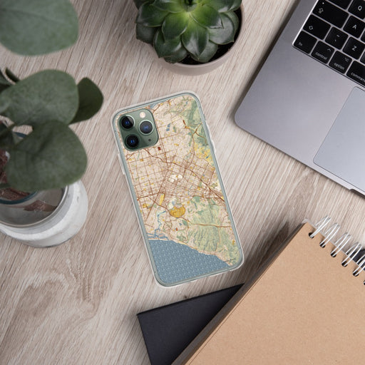 Custom Irvine California Map Phone Case in Woodblock on Table with Laptop and Plant