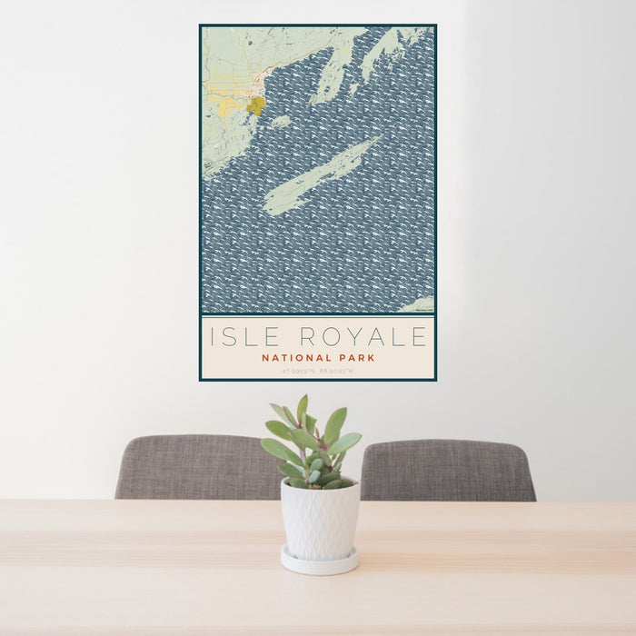 24x36 Isle Royale National Park Map Print Portrait Orientation in Woodblock Style Behind 2 Chairs Table and Potted Plant