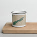 Front View Custom Isle Royale National Park Map Enamel Mug in Afternoon on Cutting Board